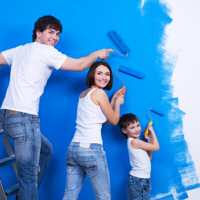 Young Family Painting The Wall